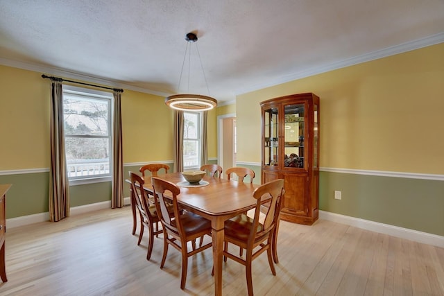 155 Middle Rd, Brentwood, NH 03833 - dining area with light wood-type flooring, ornamental molding, and baseboards
