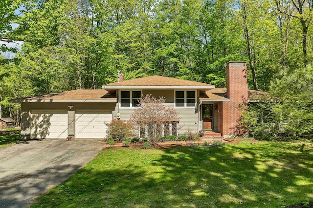 37 Port Wedeln Rd, Wolfeboro, NH 03894 - tri-level home with a chimney, an attached garage, driveway, and a front yard