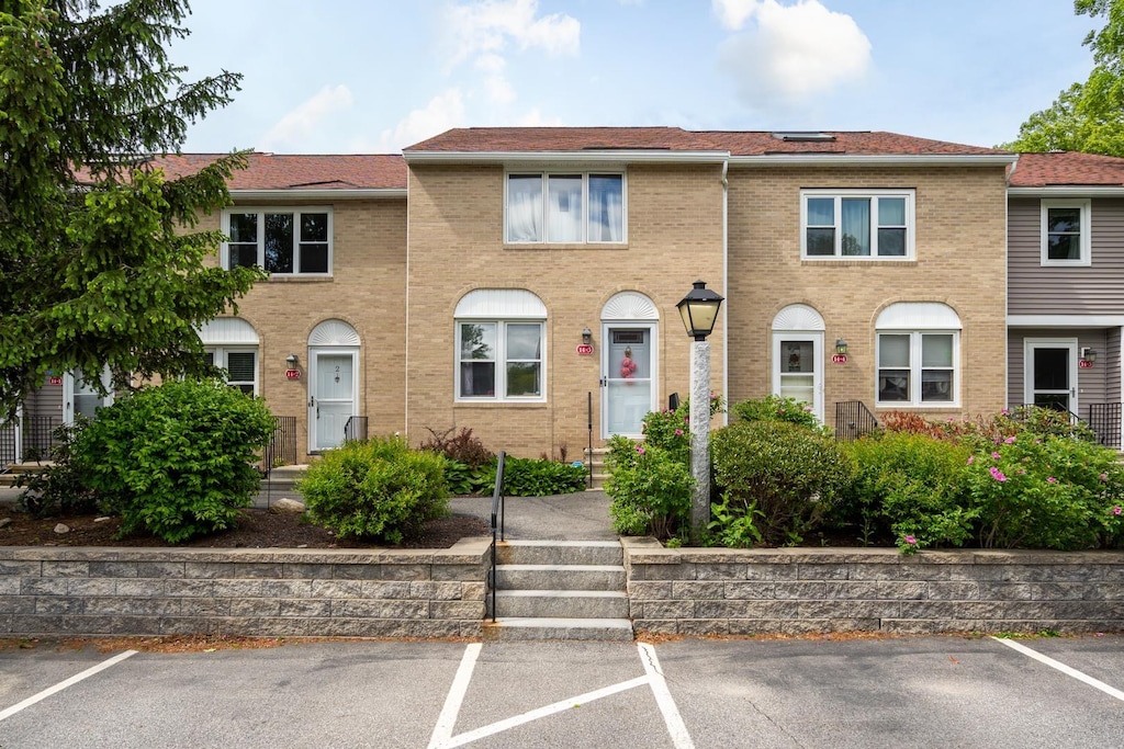 14-2 Oakwood Cir, Goffstown, NH 03045 - multi unit property with uncovered parking and brick siding