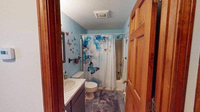 1862 Hooksett Rd, Hooksett, NH 03106 - full bathroom with a textured ceiling, toilet, vanity, and shower / tub combo