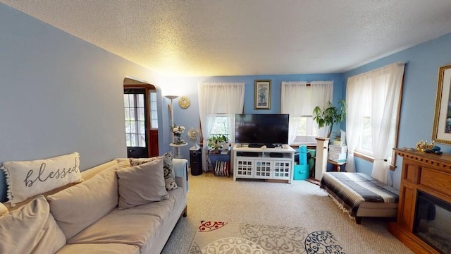 1862 Hooksett Rd, Hooksett, NH 03106 - carpeted living area featuring a textured ceiling and plenty of natural light