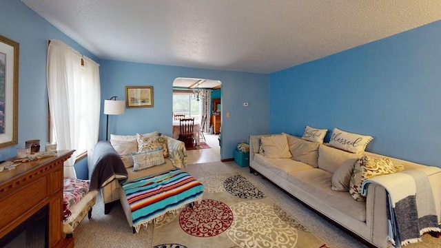 1862 Hooksett Rd, Hooksett, NH 03106 - carpeted living area featuring arched walkways and a textured ceiling