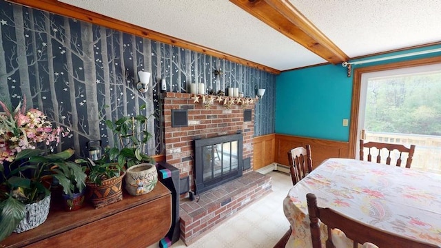 1862 Hooksett Rd, Hooksett, NH 03106 - dining area featuring beamed ceiling, a wainscoted wall, a fireplace, and a textured ceiling