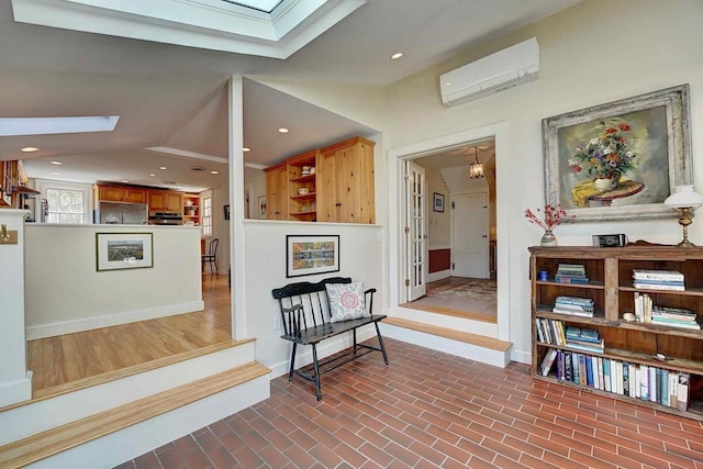 520 Washington Rd, Rye, NH 03870 - hallway with a skylight, a wall mounted AC, baseboards, recessed lighting, and vaulted ceiling