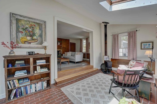 520 Washington Rd, Rye, NH 03870 - office area with a skylight, healthy amount of natural light, baseboards, and a wood stove