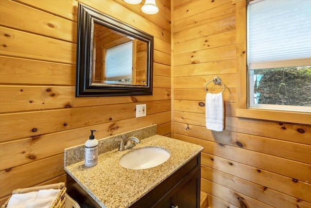 235 Pleasant View Dr, North Hero, VT 05474 - bathroom featuring wooden walls and vanity