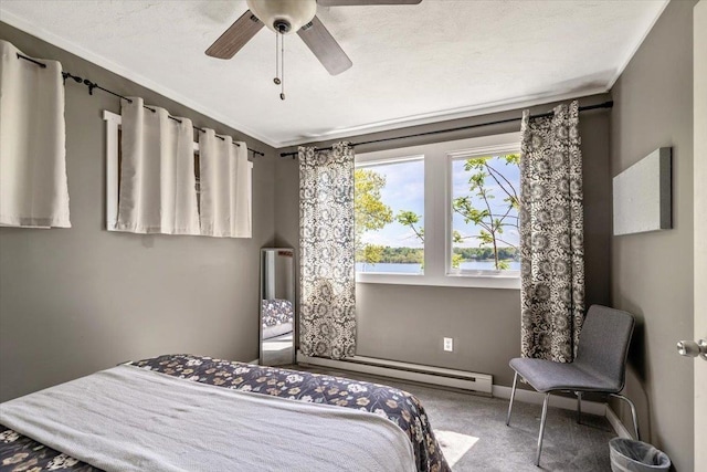 235 Pleasant View Dr, North Hero, VT 05474 - carpeted bedroom featuring ornamental molding, a ceiling fan, and baseboards