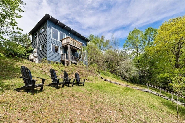 235 Pleasant View Dr, North Hero, VT 05474 - back of house with a balcony and a lawn