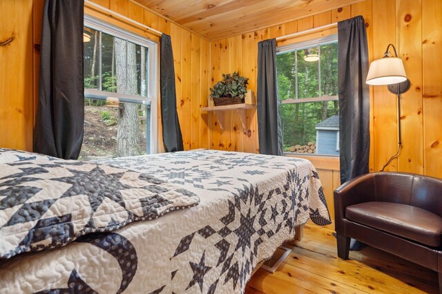 239 NE Pond Rd, Milton, NH 03851 - bedroom featuring wooden ceiling, wood-type flooring, and wooden walls