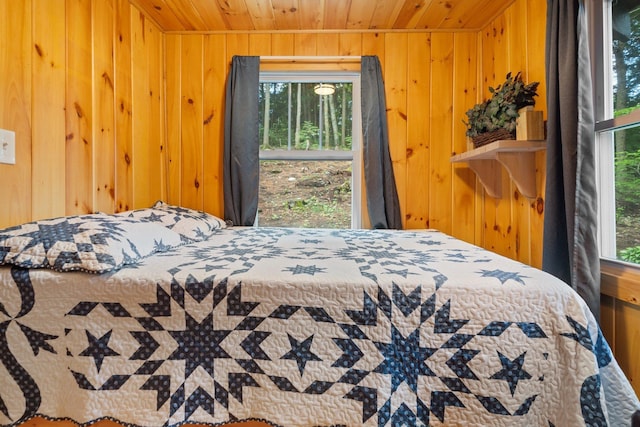 239 NE Pond Rd, Milton, NH 03851 - bedroom featuring wooden ceiling and wood walls