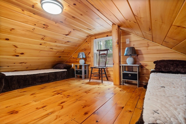 239 NE Pond Rd, Milton, NH 03851 - bedroom featuring hardwood / wood-style floors, vaulted ceiling, wood ceiling, and wooden walls