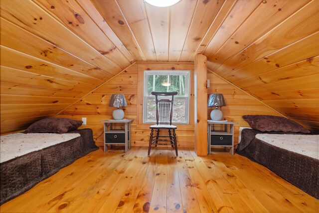 239 NE Pond Rd, Milton, NH 03851 - bedroom with hardwood / wood-style flooring, lofted ceiling, wooden ceiling, and wood walls