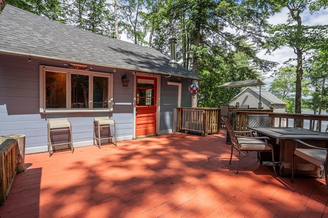 239 NE Pond Rd, Milton, NH 03851 - wooden terrace with outdoor dining space