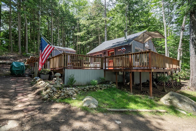 239 NE Pond Rd, Milton, NH 03851 - view of front facade featuring a deck and a forest view
