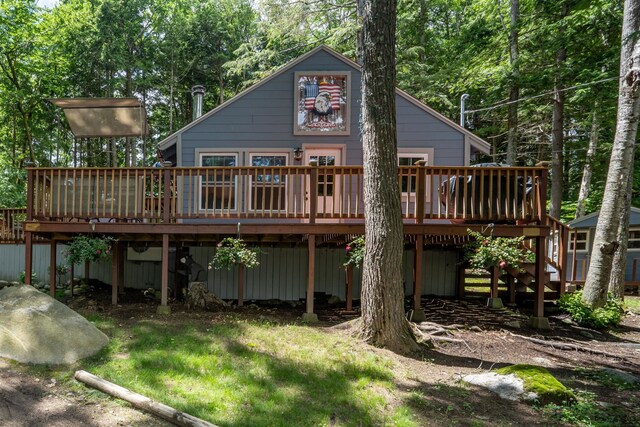 239 NE Pond Rd, Milton, NH 03851 - back of property with a wooden deck