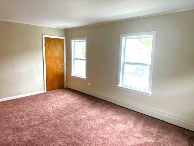 54 E Center St, Rutland City, VT 05701 - carpeted empty room with healthy amount of natural light and baseboards