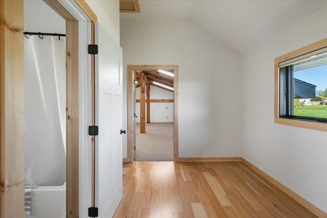 64 Atkins Farm Rd, Ferrisburgh, VT 05456 - hall with lofted ceiling and light wood-style flooring