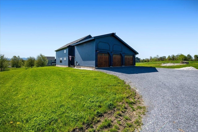 64 Atkins Farm Rd, Ferrisburgh, VT 05456 - view of outdoor structure featuring driveway and an attached garage
