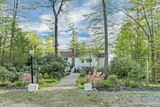 74 Keewaydin Rd, Wolfeboro, NH 03894 - view of front of house with a chimney and stairs