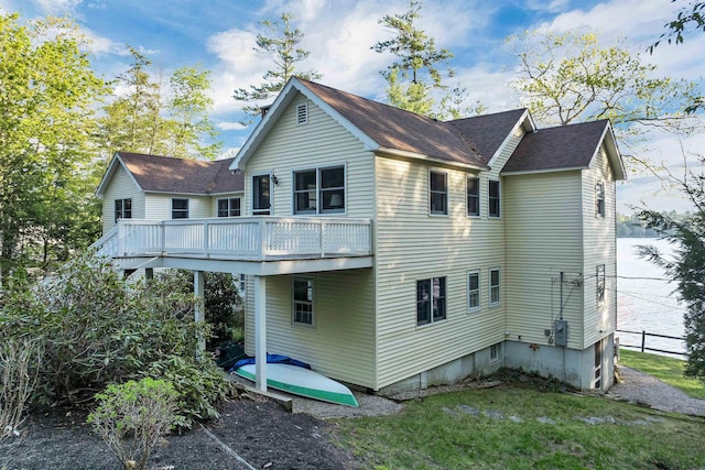 74 Keewaydin Rd, Wolfeboro, NH 03894 - rear view of property with a deck, a shingled roof, and a lawn
