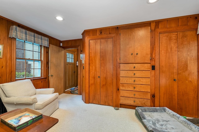 74 Keewaydin Rd, Wolfeboro, NH 03894 - living area featuring carpet floors, wood walls, and recessed lighting