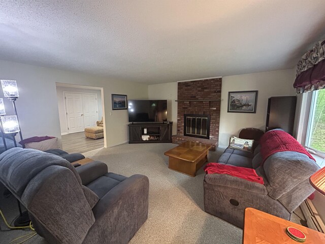 7 Juniper Ridge Rd, Exeter, NH 03833 - carpeted living area featuring a fireplace and a textured ceiling