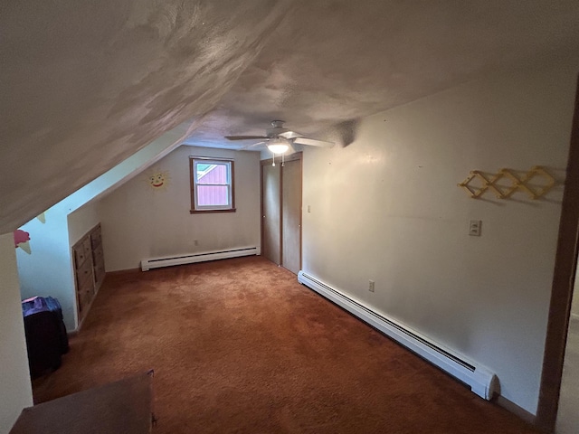 7 Juniper Ridge Rd, Exeter, NH 03833 - additional living space with baseboard heating, a baseboard heating unit, carpet floors, a ceiling fan, and lofted ceiling