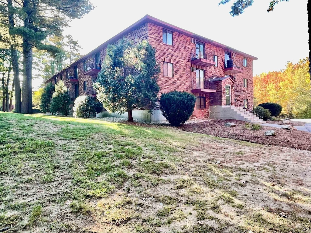 1265 Bodwell Rd Unit 13, Manchester, NH 03109 - view of side of property with brick siding