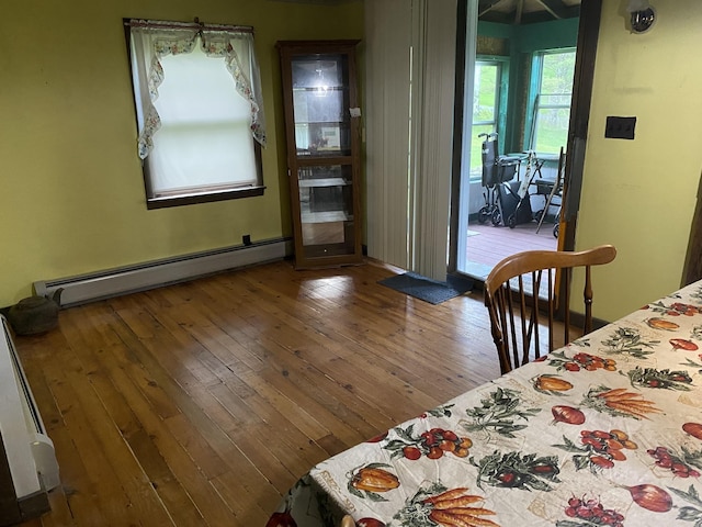 178 Parsons Rd, Wilmington, VT 05363 - dining space featuring a baseboard heating unit and wood-type flooring
