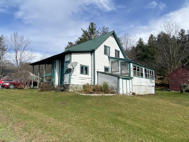 178 Parsons Rd, Wilmington, VT 05363 - view of side of home with a yard and metal roof