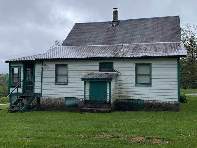 178 Parsons Rd, Wilmington, VT 05363 - back of house featuring entry steps, a yard, metal roof, and a chimney