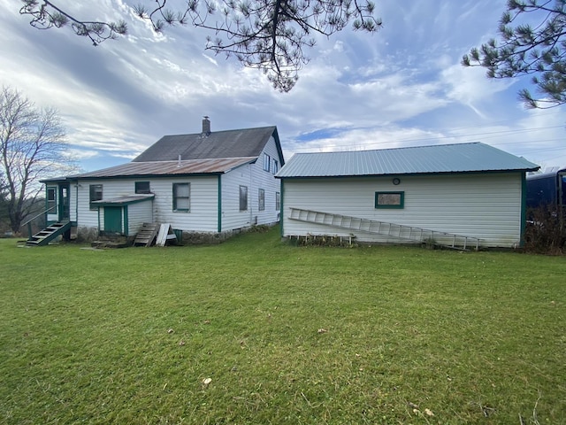 178 Parsons Rd, Wilmington, VT 05363 - back of house featuring entry steps, metal roof, and a yard