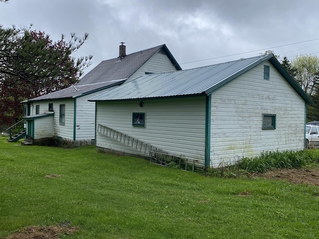 178 Parsons Rd, Wilmington, VT 05363 - view of side of home with a lawn, metal roof, and a chimney