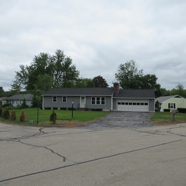 70 Forest Park Dr, Nashua, NH 03060 - single story home with driveway, an attached garage, a chimney, and a front yard
