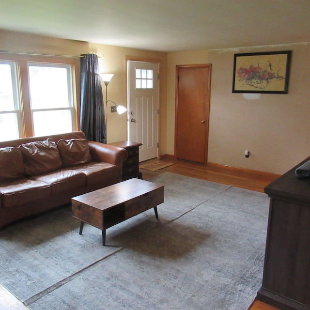 70 Forest Park Dr, Nashua, NH 03060 - living area with light wood-style floors and baseboards