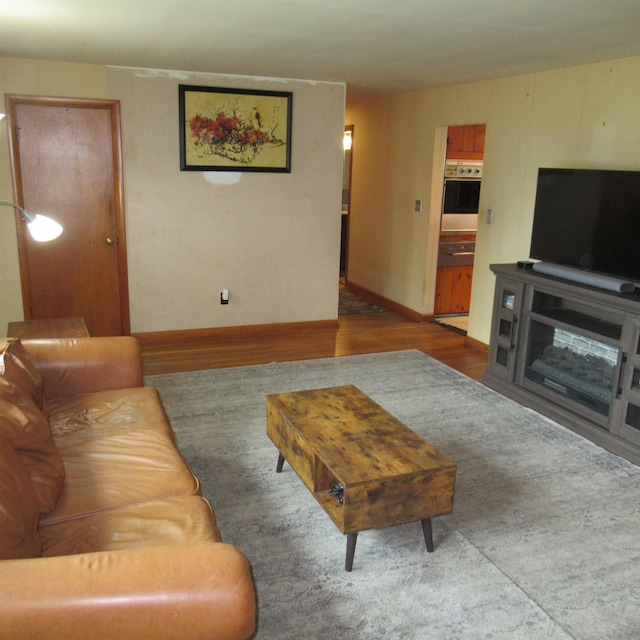 70 Forest Park Dr, Nashua, NH 03060 - living room featuring wood finished floors and baseboards