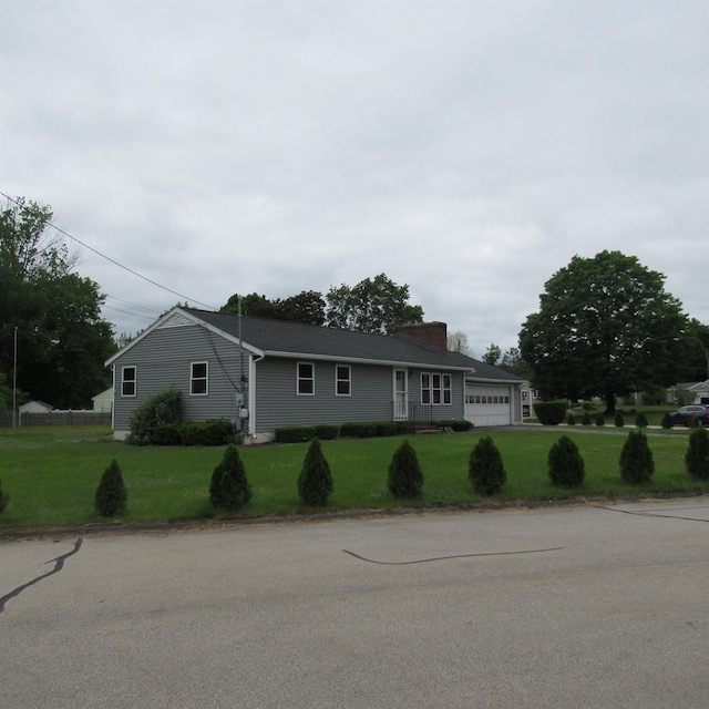 70 Forest Park Dr, Nashua, NH 03060 - ranch-style house with a front yard, a chimney, and a garage