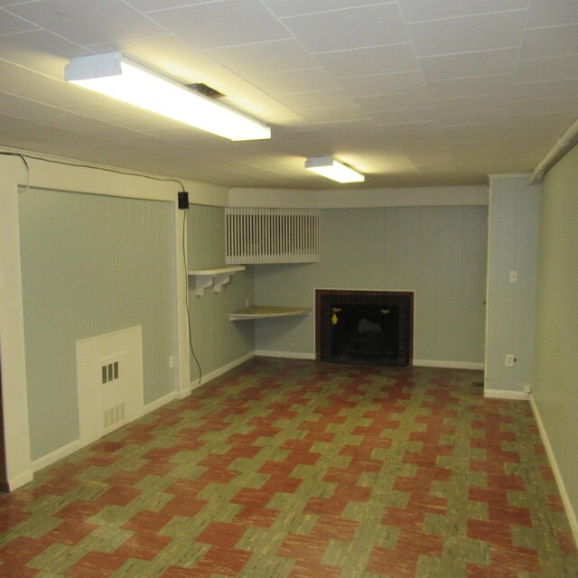70 Forest Park Dr, Nashua, NH 03060 - finished below grade area featuring a fireplace, baseboards, and carpet flooring