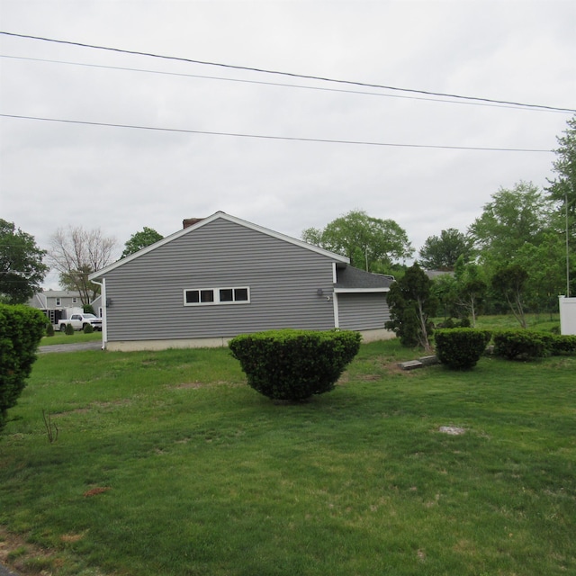 70 Forest Park Dr, Nashua, NH 03060 - view of home's exterior featuring a yard