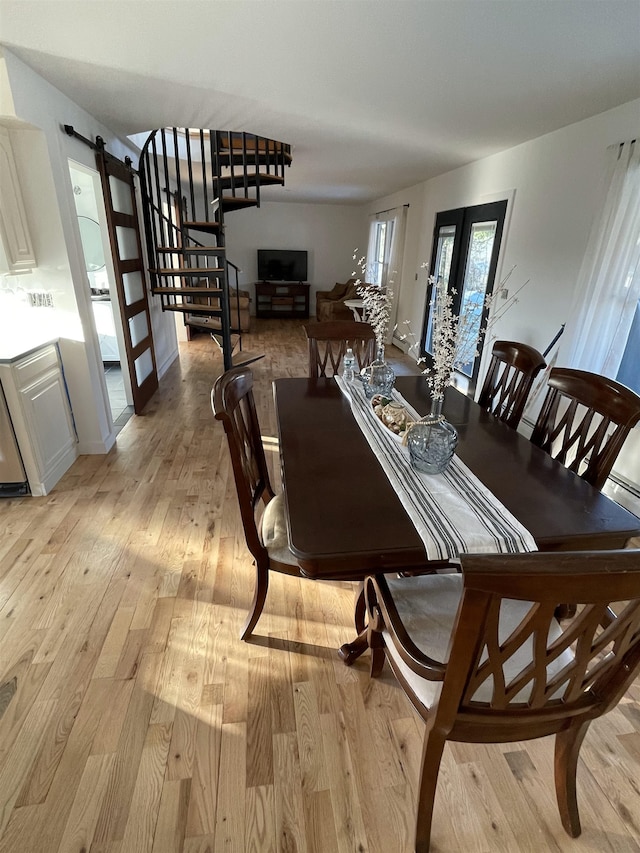 885 N St, Wells, VT 05774 - dining area featuring stairs, light wood-type flooring, and french doors