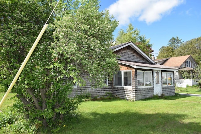 18 Bridge St, Lancaster, NH 03584 - rear view of property with a lawn