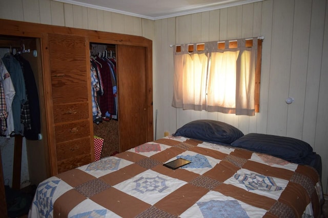 18 Bridge St, Lancaster, NH 03584 - bedroom with ornamental molding, wood walls, and a closet