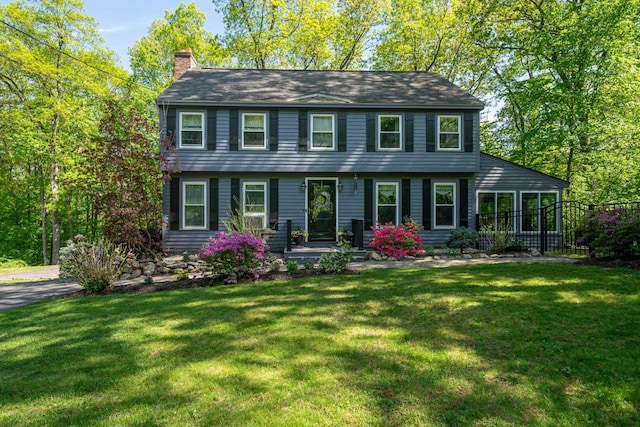 145 Warner Hill Rd, Derry, NH 03038 - colonial-style house with a chimney and a front yard