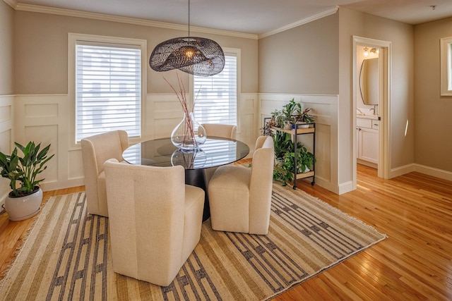 37 Lenox Dr Unit B, Dover, NH 03820 - dining area with light wood finished floors, wainscoting, a decorative wall, and ornamental molding
