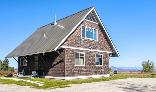 360 Coles Rd, Westmore, VT 05860 - back of property featuring metal roof and a mountain view