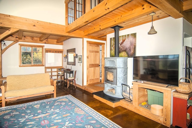 360 Coles Rd, Westmore, VT 05860 - living room with beam ceiling and a wood stove