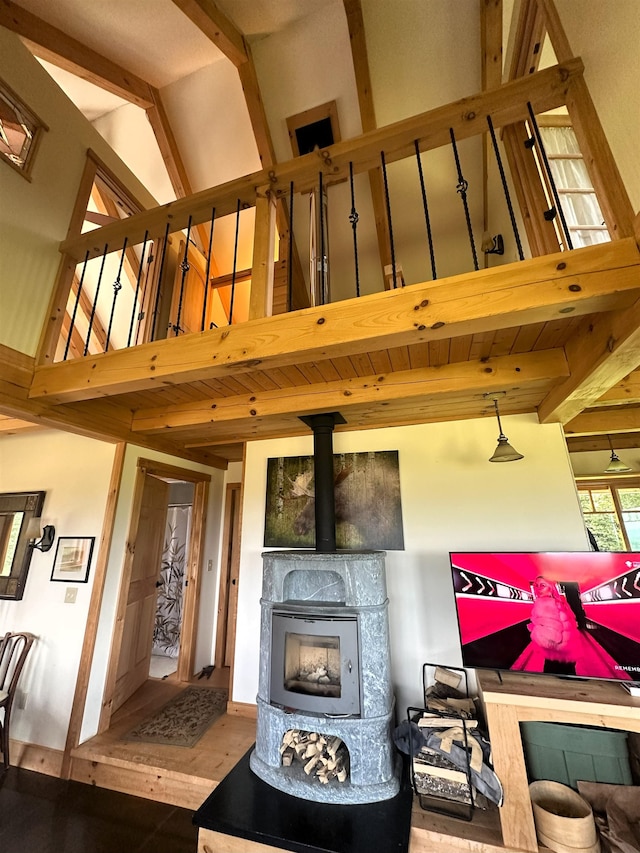 360 Coles Rd, Westmore, VT 05860 - living area with beam ceiling, wood finished floors, and high vaulted ceiling