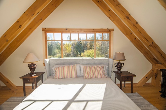 360 Coles Rd, Westmore, VT 05860 - bedroom featuring lofted ceiling, wood finished floors, and multiple windows