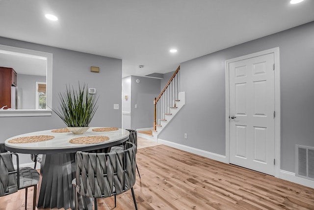 6 Swift Ln, Merrimack, NH 03054 - dining space featuring baseboards, stairs, light wood-style flooring, and recessed lighting