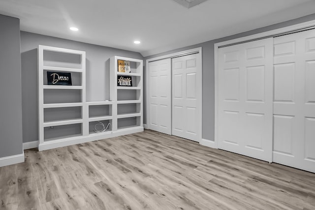 6 Swift Ln, Merrimack, NH 03054 - unfurnished bedroom with two closets, wood finished floors, baseboards, and recessed lighting